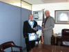 Stan recieving flag from Ed Staback